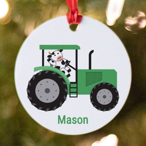 Green tractor with cow ornament